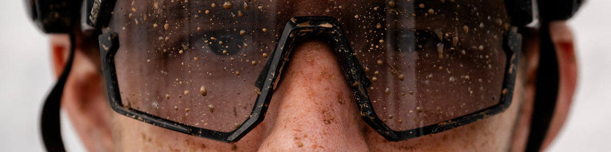 Close-up of a person wearing goggles with a blurred background
